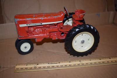 red metal tractor toy