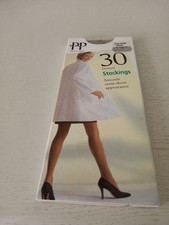 A PAIR OF VINTAGE PRETTY POLLY 30 DENIER STOCKINGS IN FAWN SIZE 3 - 8
