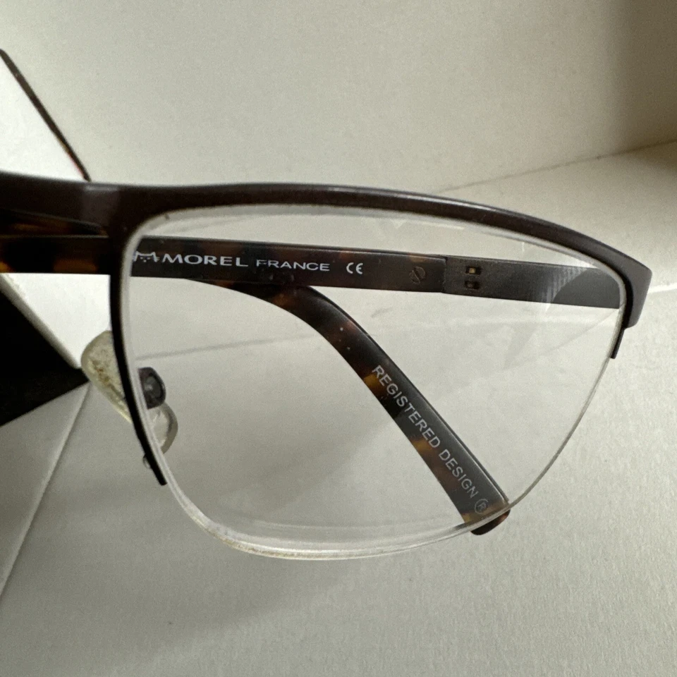 Armação de óculos óptica OGA Morel 10089O marrom MD12 semi aro metal 57-19-145 - Imagem 2 de 4