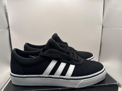 Adidas Adi Ease Shoes in Core Black/White/White feature a durable suede or canv