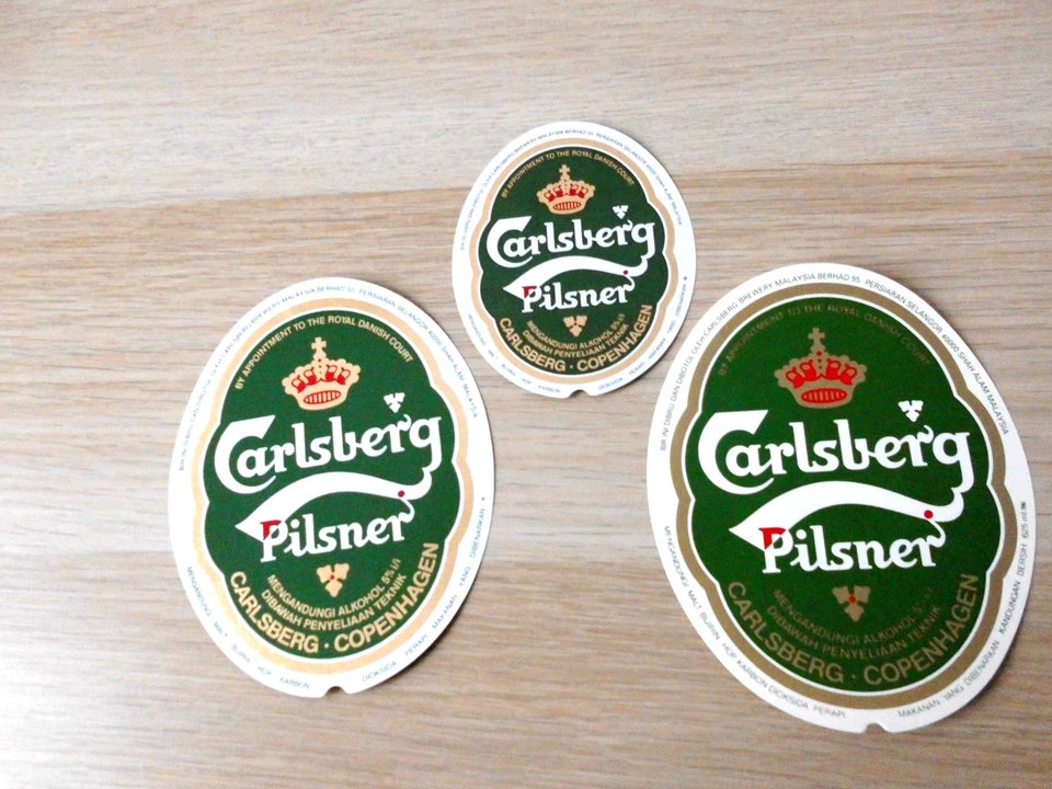 3 Bieretiketten Übersee -von Carlsberg Madakascar  BE 01 - Serie 04 - 2026 - Bild 1 von 1