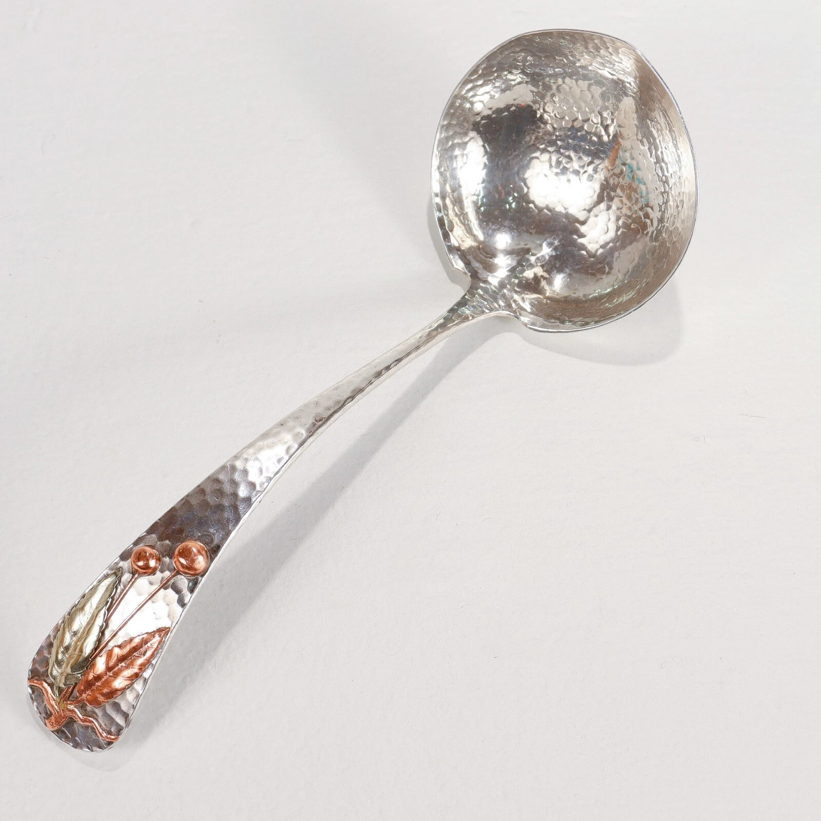 Antique Gorham Hand-Hammered Sterling Silver & Mixed Metals Sauce Ladle.
Opens in a new window or ta