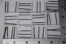 4100.00 - 12 - BLACK STREAMERS ON 3mm CLEAR 1" x 1" BULLSEYE GLASS 90 COE