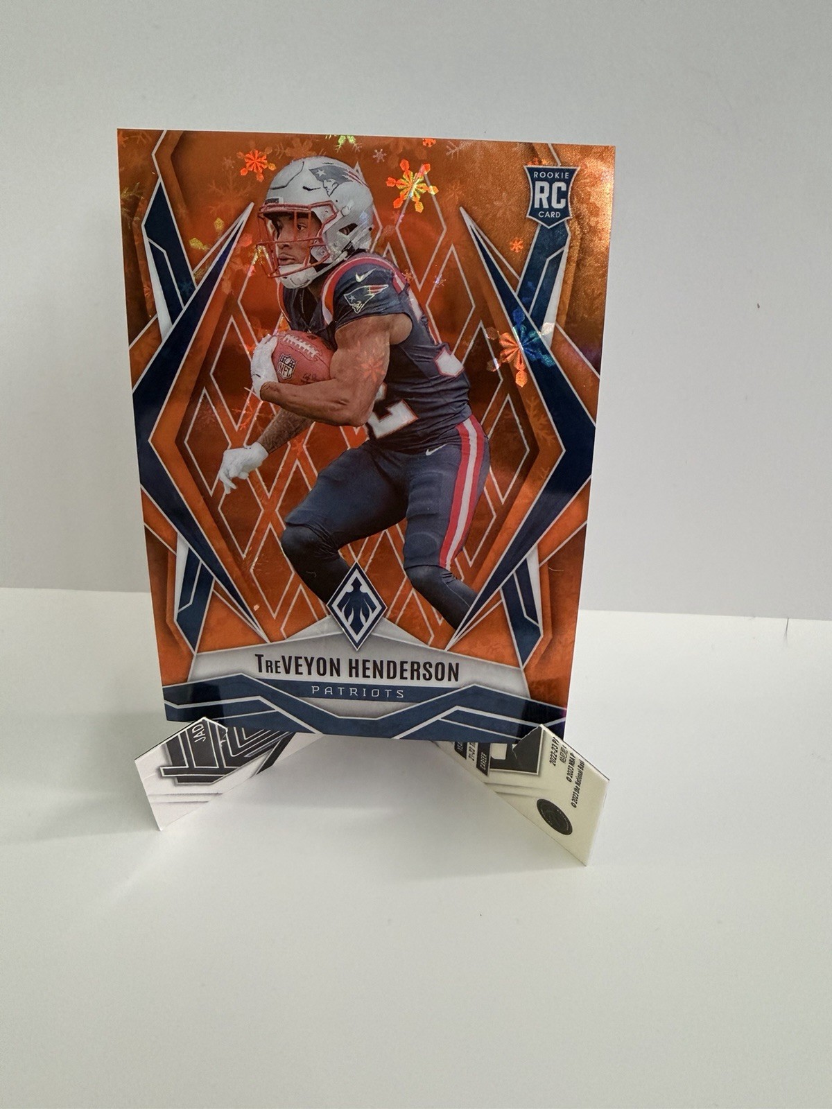 2025 Panini Phoenix - Rookies TreVeyon Henderson #187 Orange Winter /99 (RC)