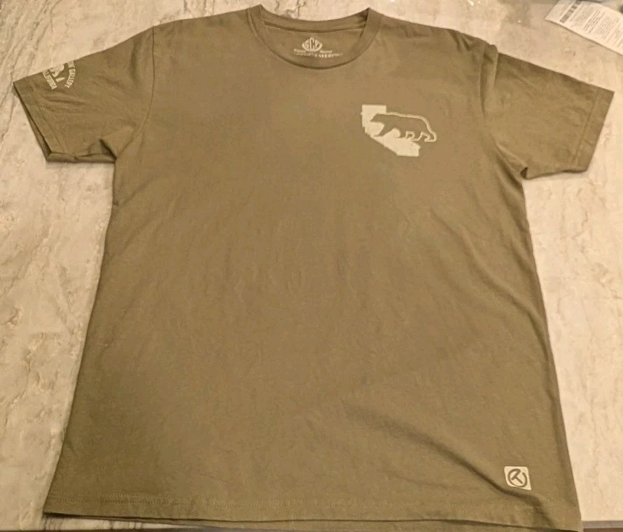 Camiseta Scotty Cameron ForeCaddie Rescue círculo T verde L Gallery 2021 US Open - Imagem 3 de 4