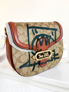 terrain crossbody in signature canvas with rexy by guang yu