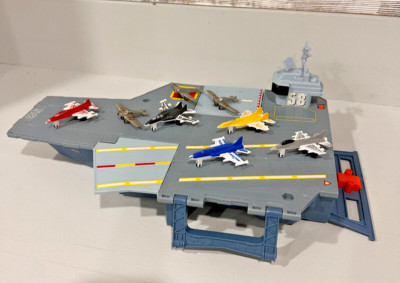 AIRCRAFT CARRIER toy, with Fighter Jets. retractable flight deck. storge inside.