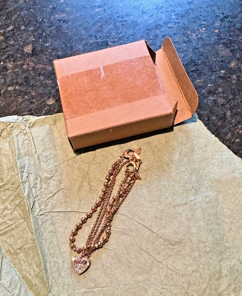 Paquete Pulsera Fósil: Corazón Cristal Dije Tono Oro Rosa Cadena + Doble Hilo Foto 2 de 4