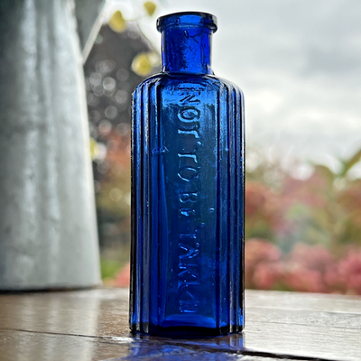 Blue 1 oz Vintage Glass Not To Be Taken Embossed Hexagonal Blue