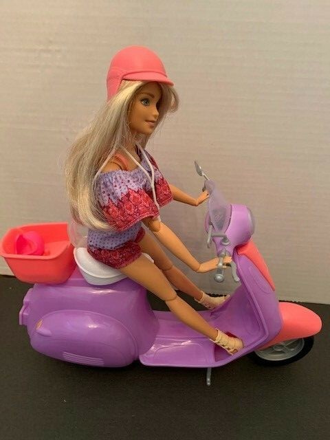 barbie pink passport scooter with doll and accessories