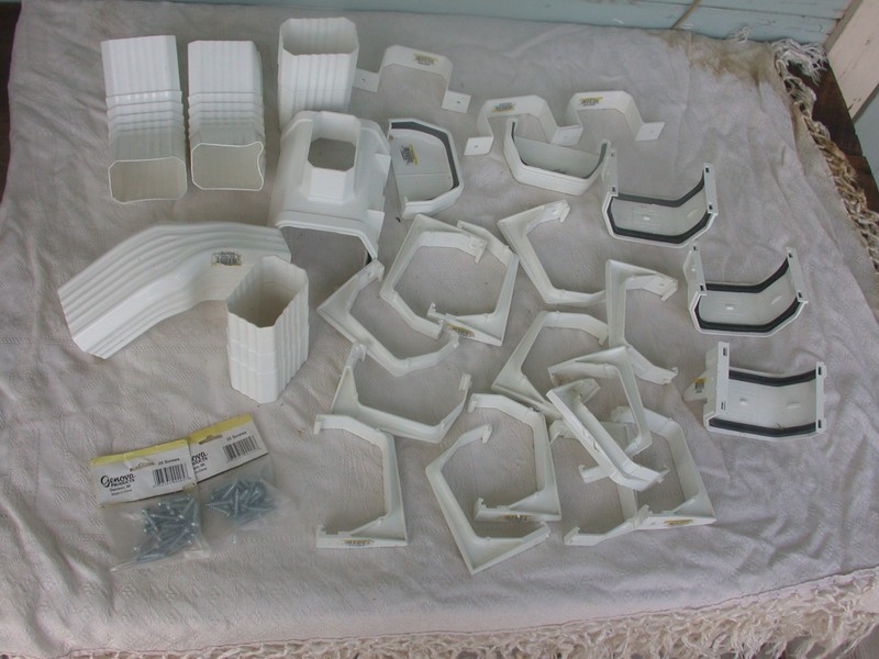 lot of 28 parts - Genova plastic gutter connectors, elbows, bracket hangers etc