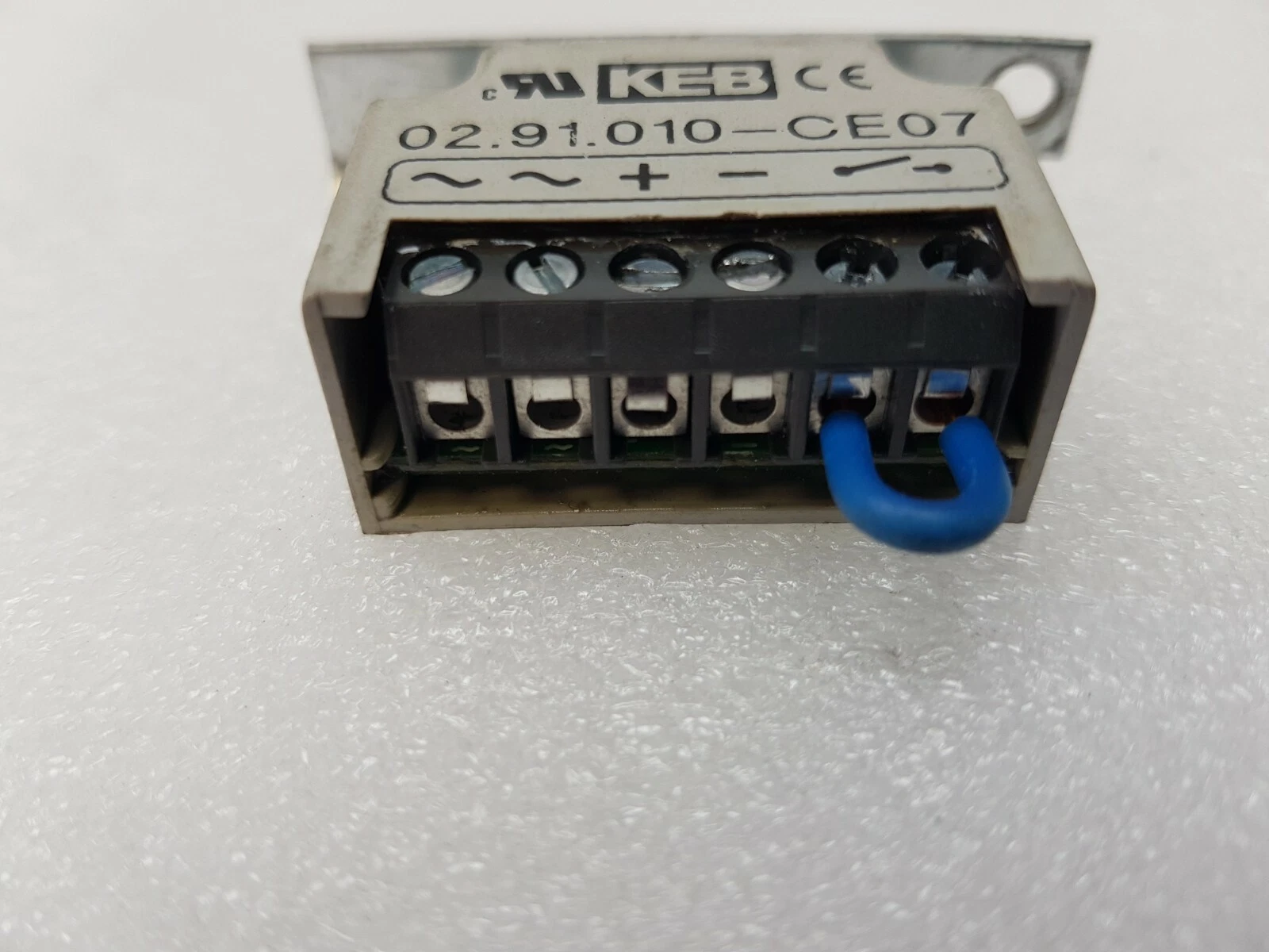 KEB 02.91.010-CE07 half-wave rectifier terminal strip marked ~ ~ + − and switch, with blue jumper