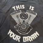 Black t-shirt with white outline of a motorcycle engine and the text “THIS IS YOUR BRAIN ON DRUGS” MADE IN USA.
