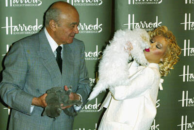 Christina Aguilera is welcomed by Mohamed Al Fayed before opening- 2004 Photo