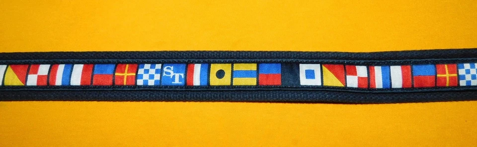 CINTURÓN MAREA SUR MOTIVO BANDERAS MULTICOLOR ALGODÓN CON PESTAÑAS CUERO TALLA 34". Foto 4 de 4