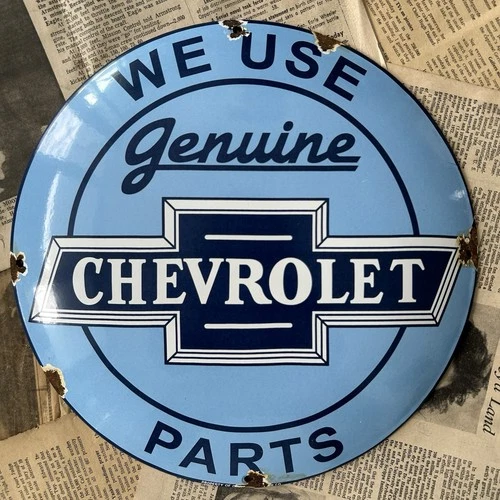 VINTAGE WE USE GENUINE CHEVROLET PARTS 12 INCH CONVEX PORCELAIN ENAMEL SIGN