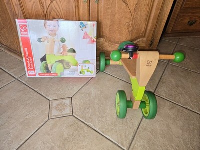   Four wheeled Wooden Push Balance Bike for Toddlers, Rubberized Wheels by Hape 