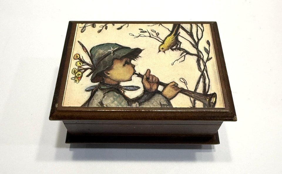 A Swiss Reuge musical movement box — Reuge is the Rolex of music boxes, and this vintage piece with its Love Story tune is a genuine collector's find under $25.