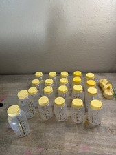 21 Medela Replacement Bottles Used in good condition W/ Tops