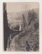 Curved Train Enters the Tunnel Man Stands Next To Unusual Snapshot Photo