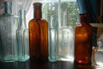 ANTIQUE 1890's SEVEN PIECE MIXED MEDICINE PRODUCT EMBOSSED BOTTLE LOT