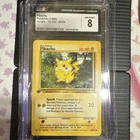 Pokémon TCG Pikachu Jungle 1st Edition 60/64 CGC 8 English 1999