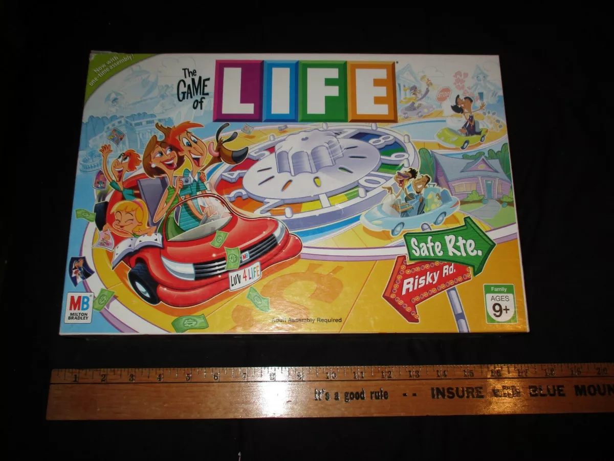 The Game of Life by Milton Bradley. The game board & all its