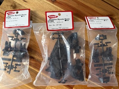Neu Kyosho Neu in Verpackung Optima OT202 Getriebe Set und 2 x OT204 Radträger Set.