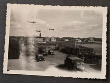 LUFTWAFFE PLANES IN FLIGHT FLYING OVER MILITA...
