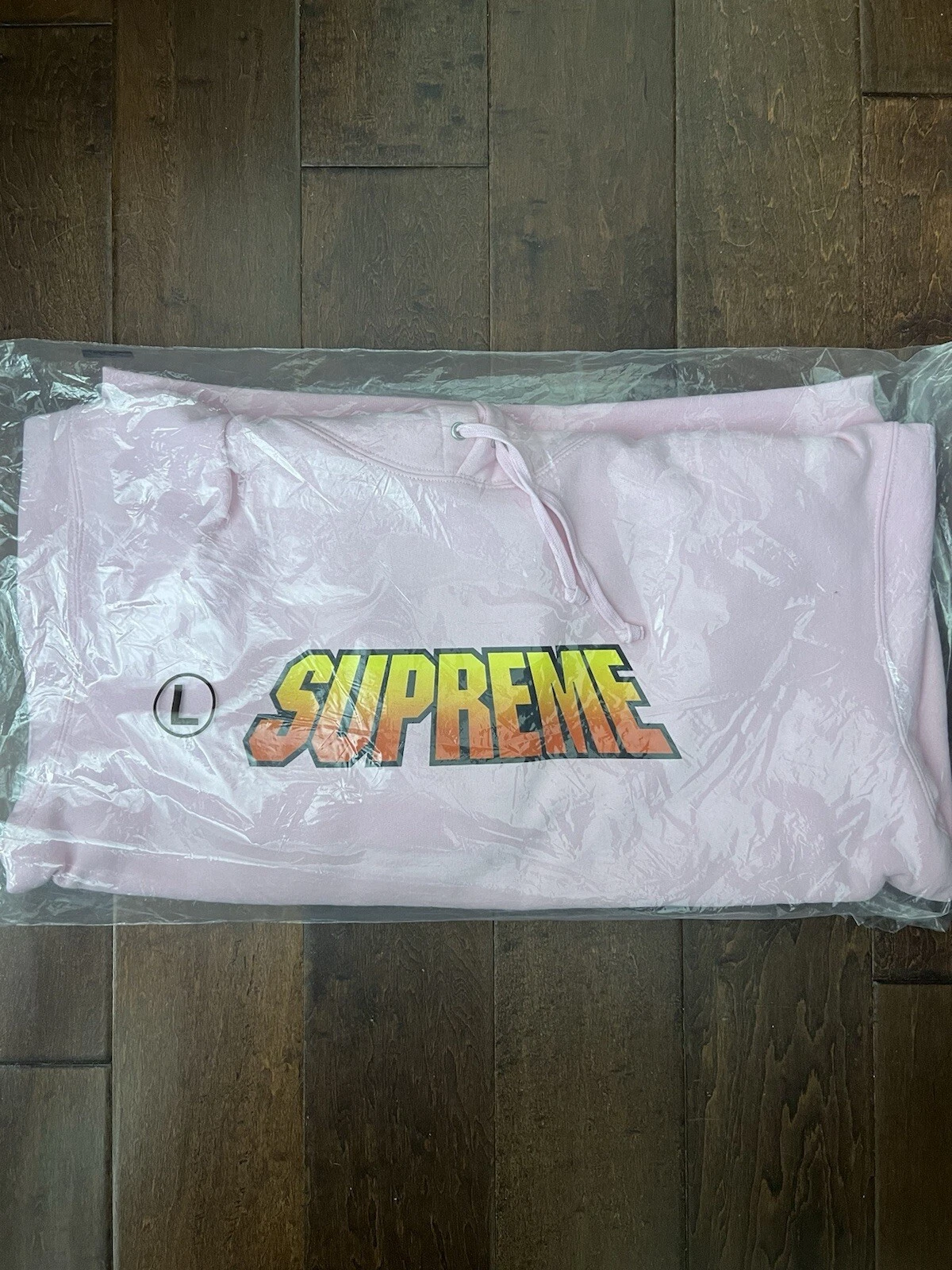 Sweat à capuche Supreme SS24 dégradé rose taille L neuf EN MAIN