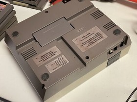 Nintendo NES console bundle with controllers, zapper, and games Tested