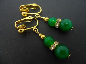 Authentic A PAIR OF GREEN JADE GOLD PLATED CLIP ON EARRINGS. .