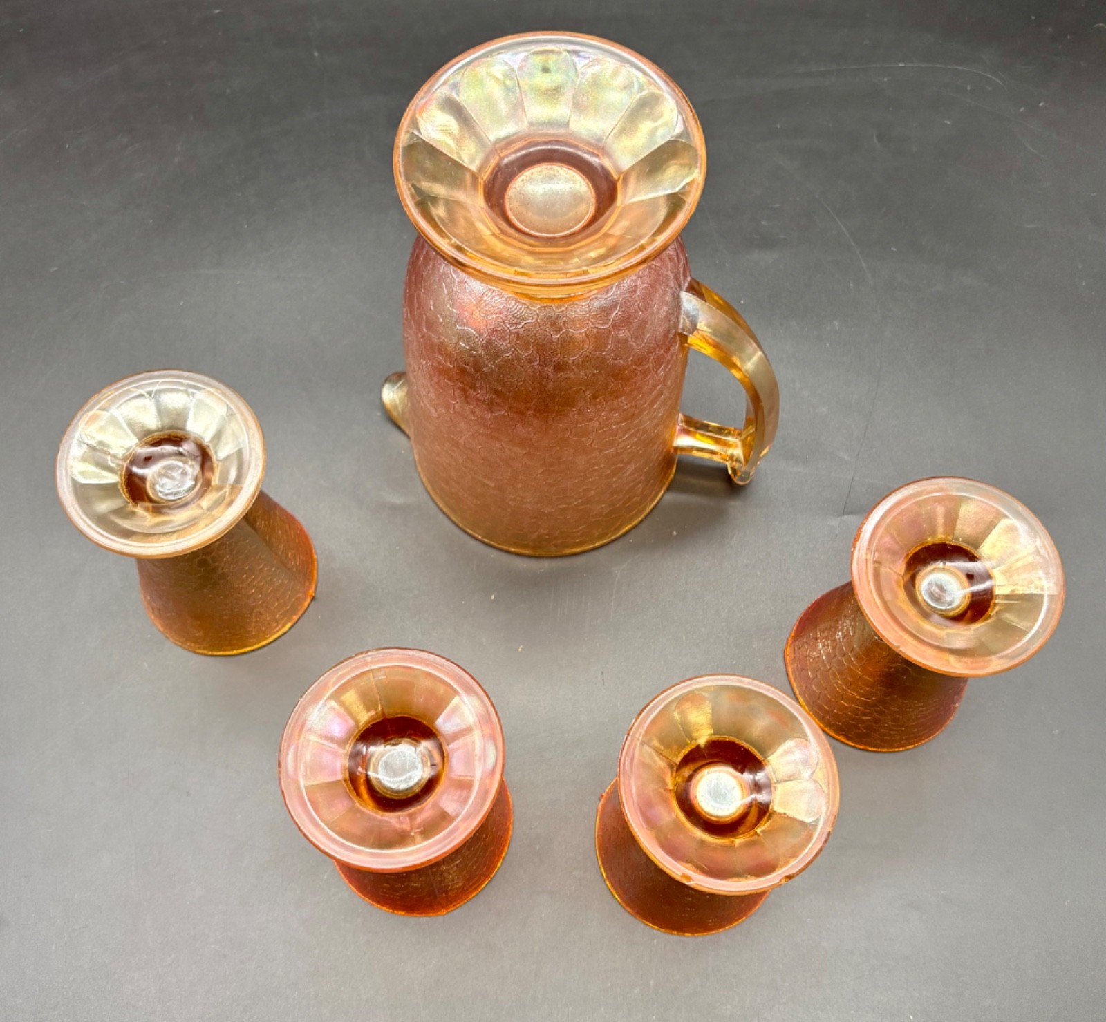 Jeanette Carnival Glass Pitcher and Four Tumblers Marigold