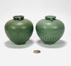 Two Thai Sawankhalok celadon pots decorated with dragon, 20th century.