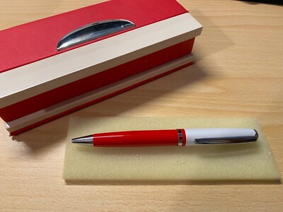 White and Red Ballpoint Pen