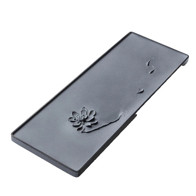 Bandejas floral de la piedra negra