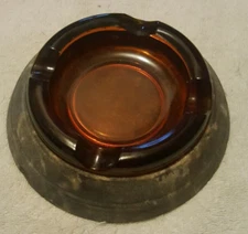 Mid-century modern ashtray, amber glass. Base Diameter  6 1/2"