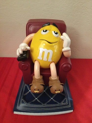 1999 m&m yellow character in chair candy dispenser collectable