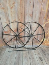 Two 24-inch Steel Wagon Wheels With 8 Spokes Along With One 23 18-inch Axle