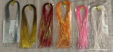 Materiales para atar moscas: flash de oropel, mejillas de zumbador, cola y acanalado para moscas de trucha