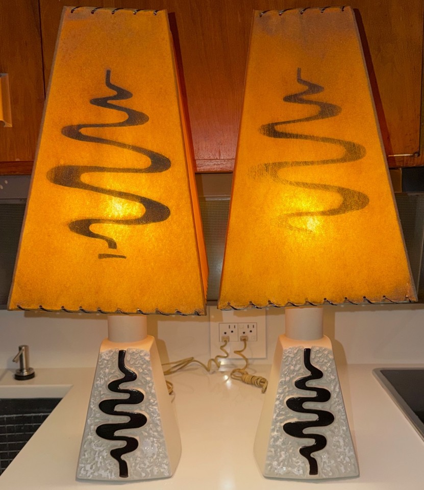 A matched pair of 1950s MCM ceramic lamps with original fiberglass shades — intact vintage sets like this are genuinely hard to find.