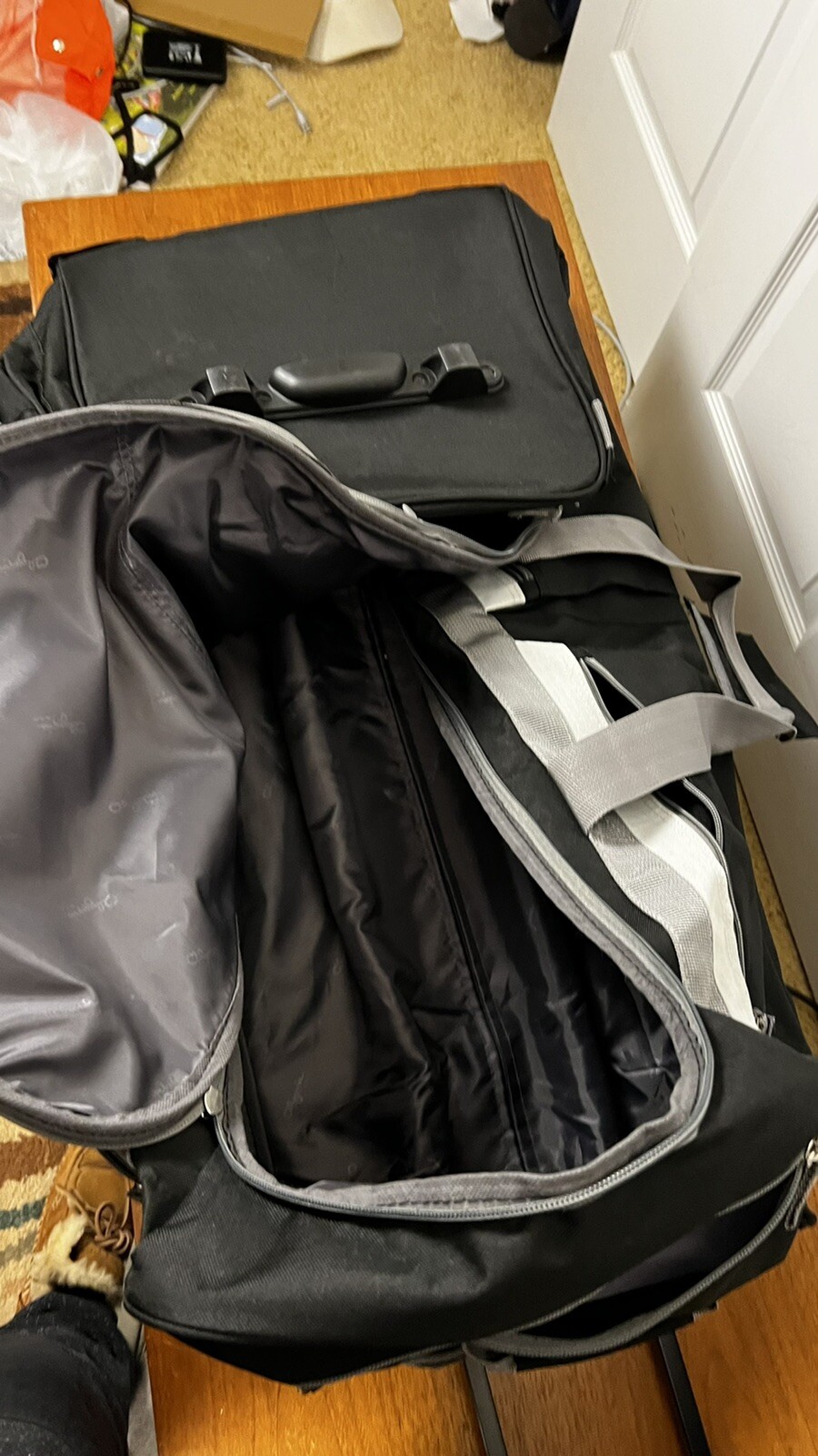 Olympia 8 Pocket Rolling Duffel Bag, Black and Gray