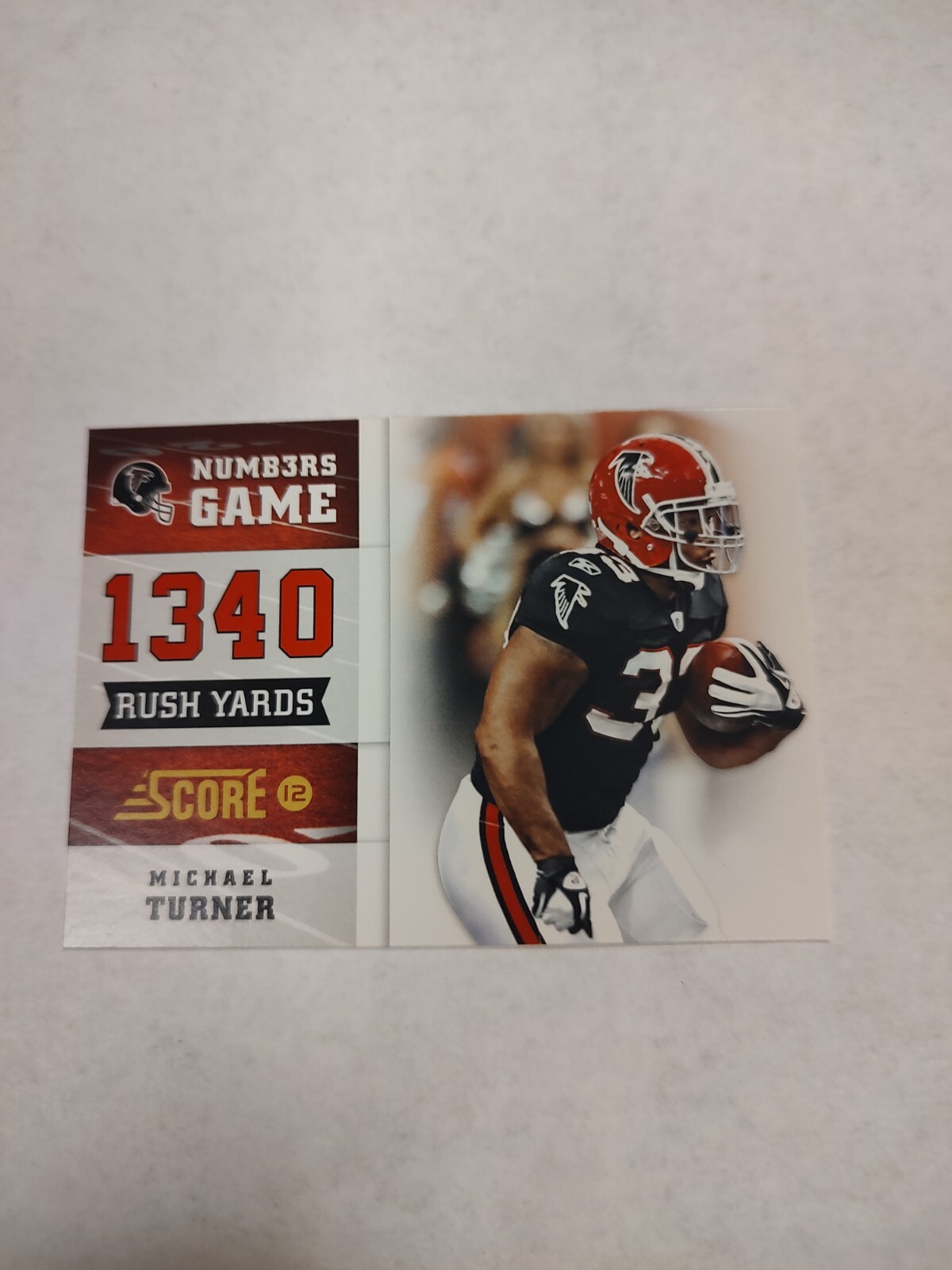 2012 Score Numbers Game #6 Michael Turner (PWE)(03)