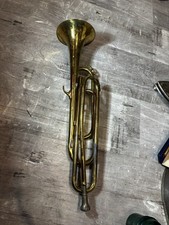 A vintage single-valve bugle, often used in marching bands, drum and bugle
