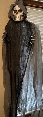 Light Up Eyes Hanging Halloween Skeleton in Rags Poseable Arms Scary Ghost Ghoul