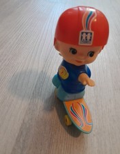 1979 Tomy "Kid-A-Long" Riding Skateboard Wind-Up Toy