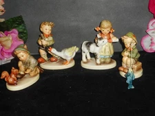 4 HUMMEL FIGURES 2228 w/GOOSE 2231 w/CALF 2232 w/SQUIRREL 907 w/BIG FISH *RARE*