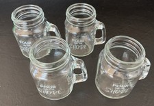 Set A Four Mini Mason Jars With Printing That Says Pour On The Shore