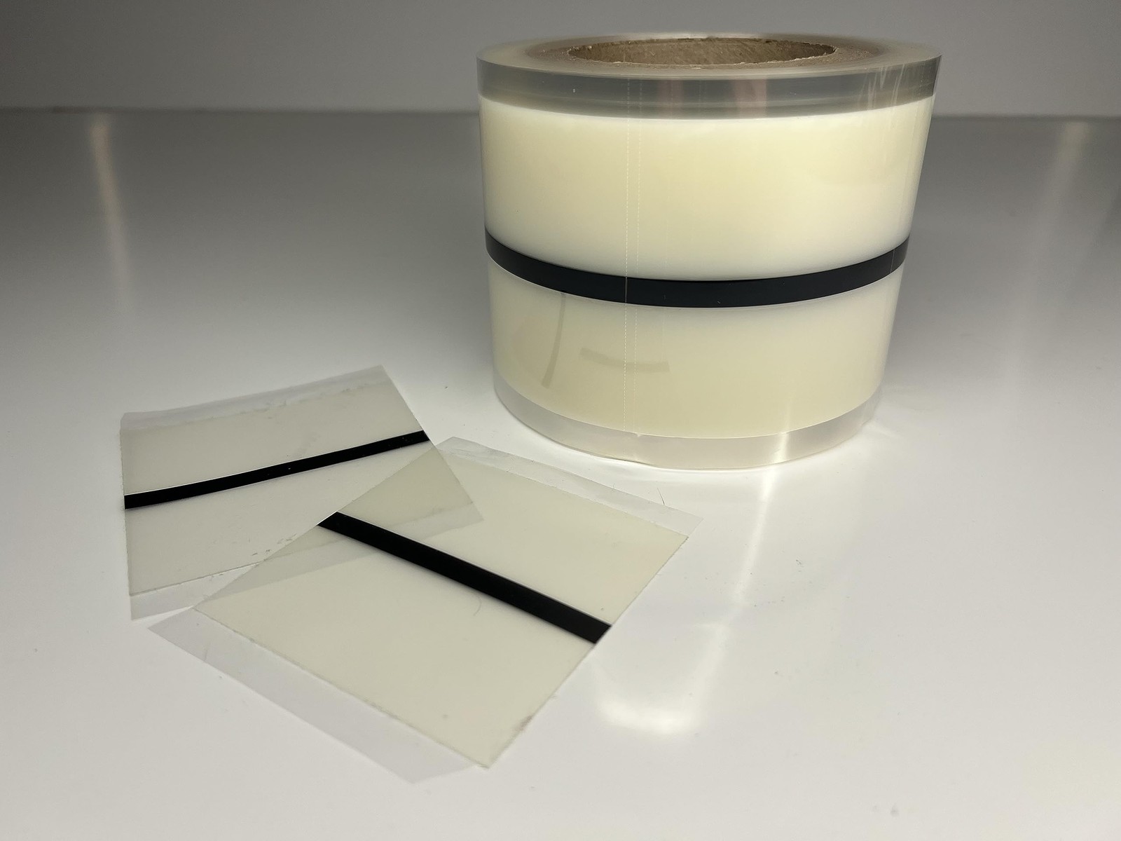 Patented tab system for floating luxury vinyl plank in commercial and residential spaces