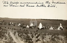 U.S. troops surrounding the Indians Wounded Knee SD 1913 RPPC Postcard COPY